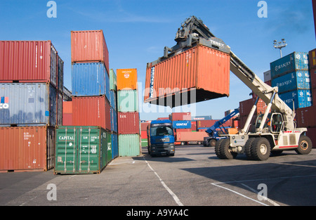 lifter loader moving freight container in container terminal Stock Photo