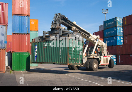 lifter loader moving freight container in container terminal Stock Photo