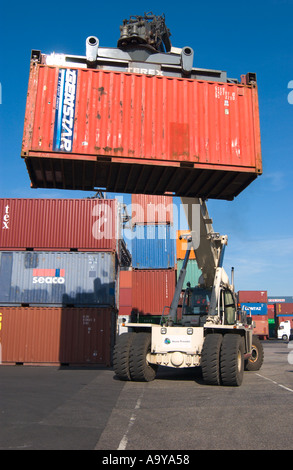 lifter loader moving freight container in container terminal Stock Photo