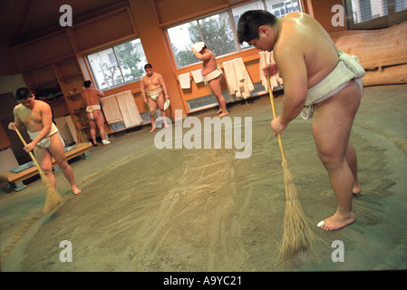 Student sumo wrestlers prepare the Dojo in Japan Stock Photo