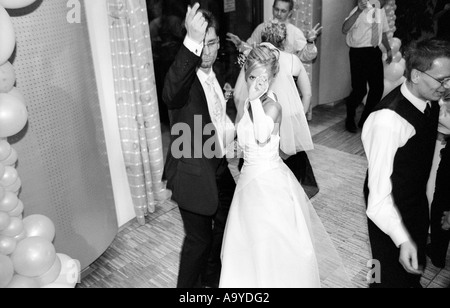 Poland, Lodz, bride and groom dancing at wedding party, elevated view (B&W) Stock Photo