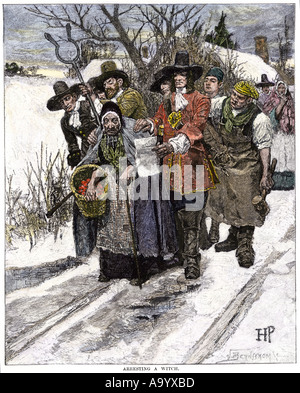 New England colonists arresting a witch 1600s. Hand-colored woodcut of a Howard Pyle illustration Stock Photo