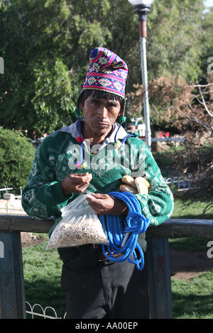 A traditional Bolivian man, campesino, peasant,  wearing a colourful woollen hat in Llallagua, Potosi, Bolivia Stock Photo