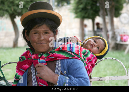 Traditional Bolivian Woman wearing a Bowler Hat  ( sombrero) & Child Stock Photo