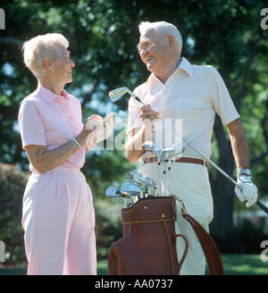 mature couple checking scores after playing golf Stock Photo