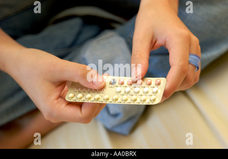 Teenager with birth control pills / the pill Stock Photo