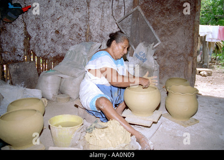 A woman making pottery Mexico Stock Photo