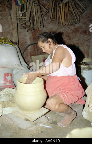 A woman making pottery Mexico Stock Photo