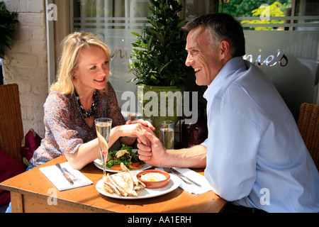 Couple sitting outside having lunch at a small Restaurant Stock Photo