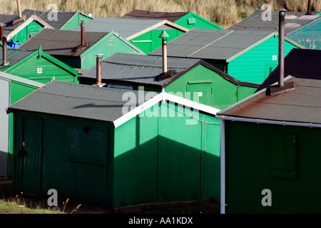 Green sheds at the south gare of the mouth of the river tees Stock Photo