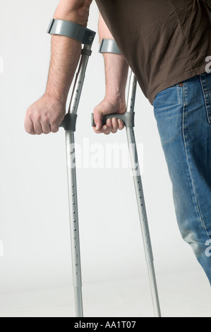 MAN ON METAL CRUTCHES MOBILITY SUPPORTS CLOSE UP Stock Photo