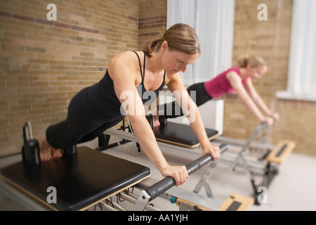 Women on Pilates Exercise Machines Stock Photo