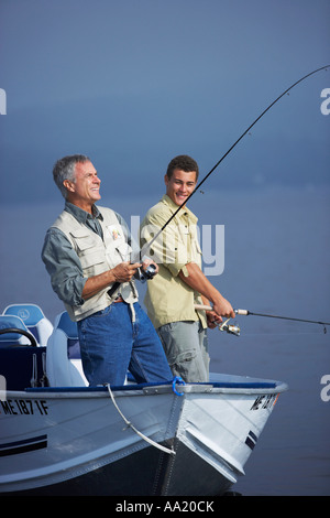 Man and Teenager Fishing, Belgrade Lakes, Maine, USA Stock Photo