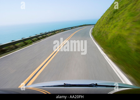 Car on Coastal Highway Stock Photo