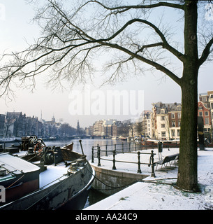 River Amstel looking towards Munttoren in the winter, Amsterdam, Netherlands Stock Photo