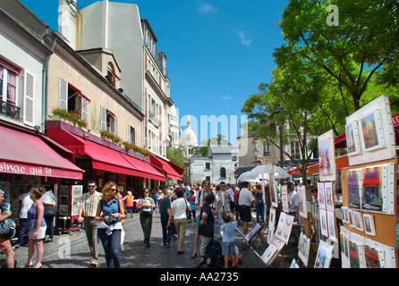 Place du Tertre with the Basilica of Sacre Coeur  in the distance, Montmartre, Paris, France Stock Photo