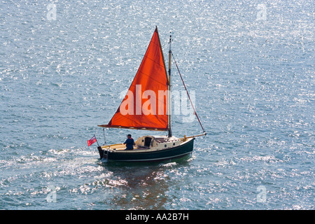 A sailing dinghy in Poole Harbour, Dorset Stock Photo