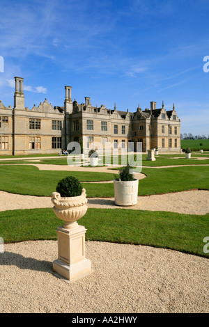 Kirby Hall Northamptonshire View Of The Restored Gardens showing New Limestone Urns and Box Topiary in the Parterre Garden Stock Photo