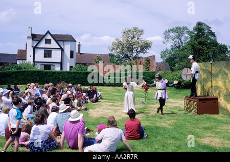 Open air theatre Shakespeare audience sitting on grass Actors Boscobel House, Shropshire, England, UK, performance, acting, Stock Photo