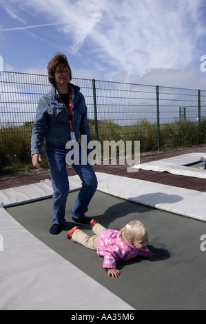 Sylt father and daughter having fun on a trampoline Stock Photo