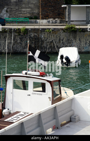 A Cornish flag being flown on a boat, Padstow, Cornwall, UK. Stock Photo