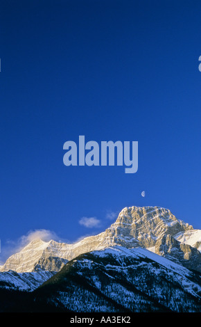 Moon setting over Mount Lougheed Wind Valley Provincial Park Alberta Canada Stock Photo
