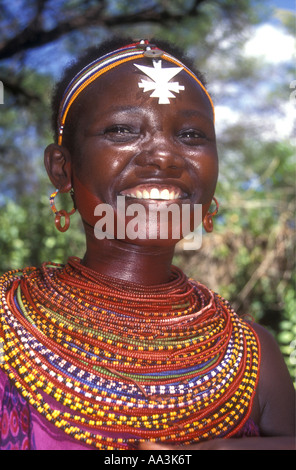 Pretty young Samburu woman wearing brightly coloured bead necklaces and headbands Northern Kenya East Africa Stock Photo