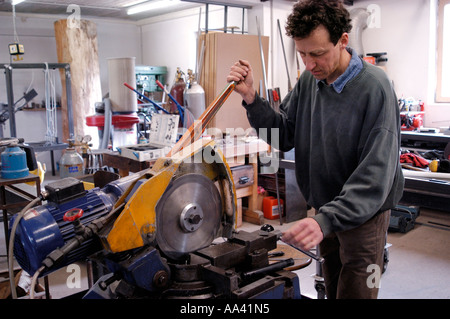 Craftsman at working in garage for metall Stock Photo