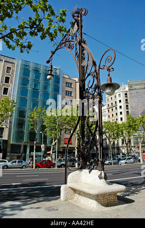 Wrought-iron street lamp and curved stone bench by Pere Falques i Urpi, Passeig de Gracia, Art Nouveau, Barcelona, Catalonia Stock Photo