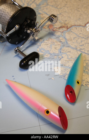 Salmon fishing concept image of trolling plugs and reel on map of B C coast Stock Photo