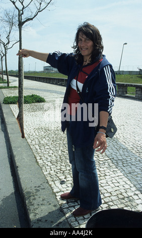 Woman selling lamprey by the roadside in Woman selling lamprey Stock Photo