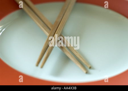 Two Chinese Wooden "Chop Sticks" Together on an Empty White Plate, "Close up", Stock Photo