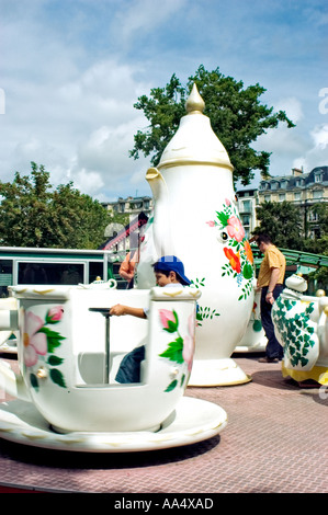 Paris FRANCE,  childrens public playground Urban Parks Children on Tea Cups Ride in 'Jardin d'Acclimatation' Park Childrens 'Amusement park » carnival Stock Photo