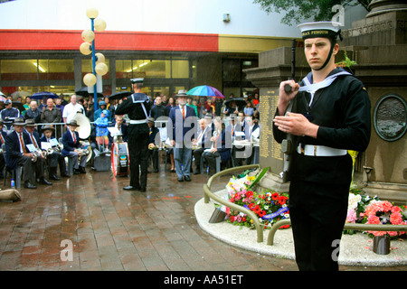A young sailor presents arms during an ANZAC day ceremony at the war memorial in Manly Australia Stock Photo