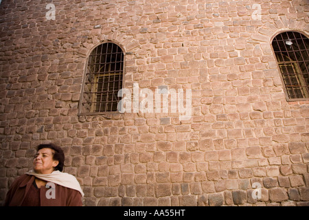 Lady outside a church in Cuzco,  Peru Stock Photo