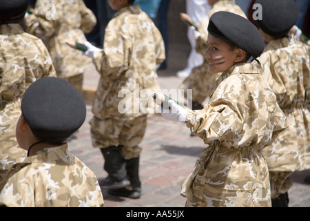 Kids playing soldiers in Cuzco,  Peru Stock Photo