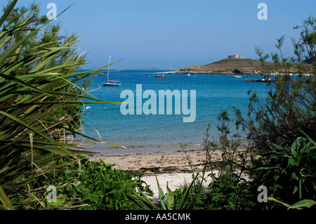 Sandy beach at Old Grimsby, Tresco, Isles of Scilly looking towards hill and the Cromwellian Fort known as The Blockhouse Stock Photo