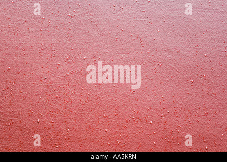 Rain droplets on red wall. Close up Stock Photo