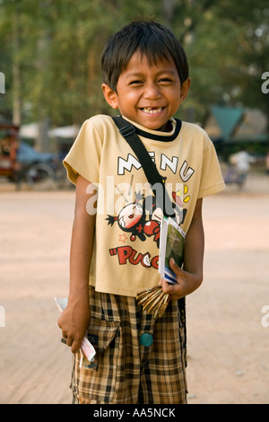 CAMBODIA ANGKOR SIEM REAP PROVINCE Child vendor selling souvenirs outside Angkor Wat Stock Photo