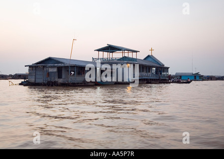 Houses and church on Tonle Sap Lake, Cambodia. Floating village of Chong Kneas, houses and church, sunset Stock Photo