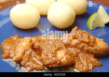 ANG103766 Food Non vegetarian Chicken curry with boiled potatoes in blue plate Stock Photo