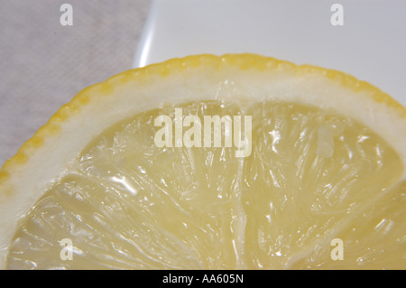 ANG103827 Fruit One lemon and slice on the plate Stock Photo