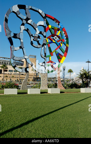 A mosaic sculpture entitled Coming Together by Niki de St Phalle with Petco Park in the background in San Diego, California, USA Stock Photo
