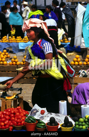WOMAN SELLING FRUIT AND VEGETABLES AT THE MARKET PLACE IN SAN JUAN CHAMULA CHIAPAS MEXICO Stock Photo