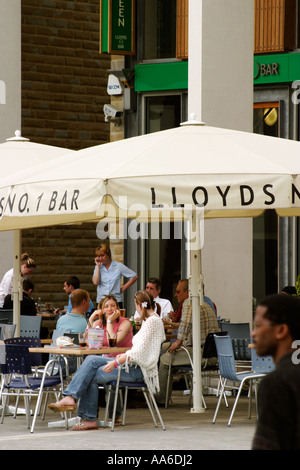 Group of people enjoying drinks outside Lloyds Bar Centenary Square Bradford Stock Photo