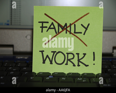 memo note on notebook, familiy crossed work Stock Photo