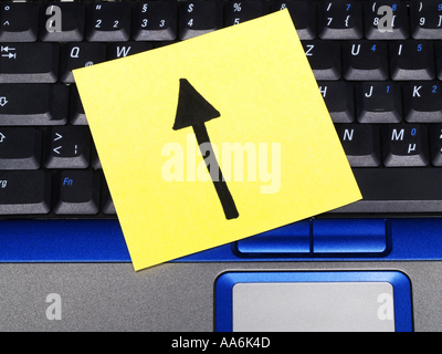 memo note on notebook, arrow up drawing Stock Photo
