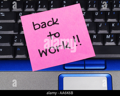 memo note on notebook, back to work Stock Photo