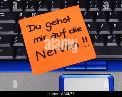 memo note on notebook Du gehst mir auf die Nerven you are on my nerves Stock Photo