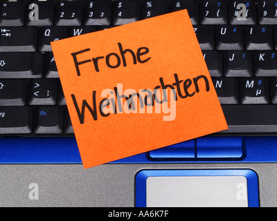 memo note on notebook, Frohe Weihnachten merry christmas Stock Photo